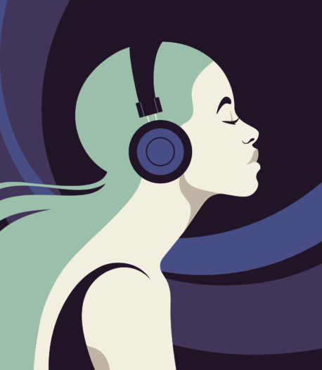 Profile of a young woman listens to the music on the headphones.